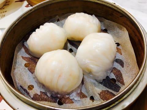 Ha gow, translucent Cantonese shrimp dumplings in a bamboo steamer