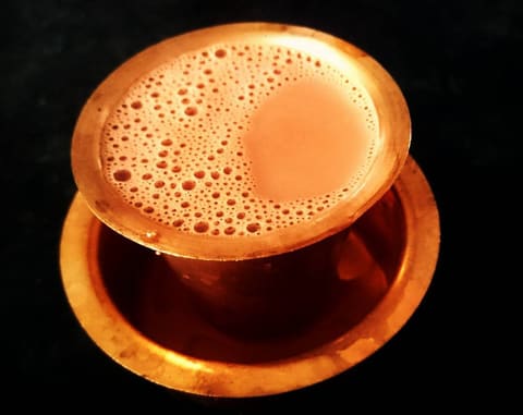 South Indian filter coffee in a brass tumbler and davara