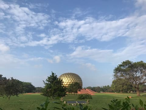 Matrimandir across a lawn
