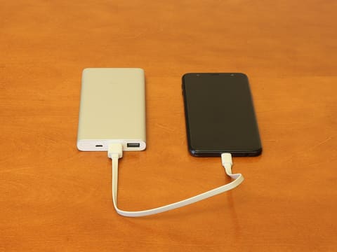 Power bank charging a phone