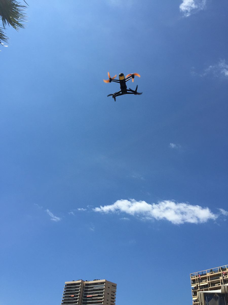 Drone flying in a blue sky